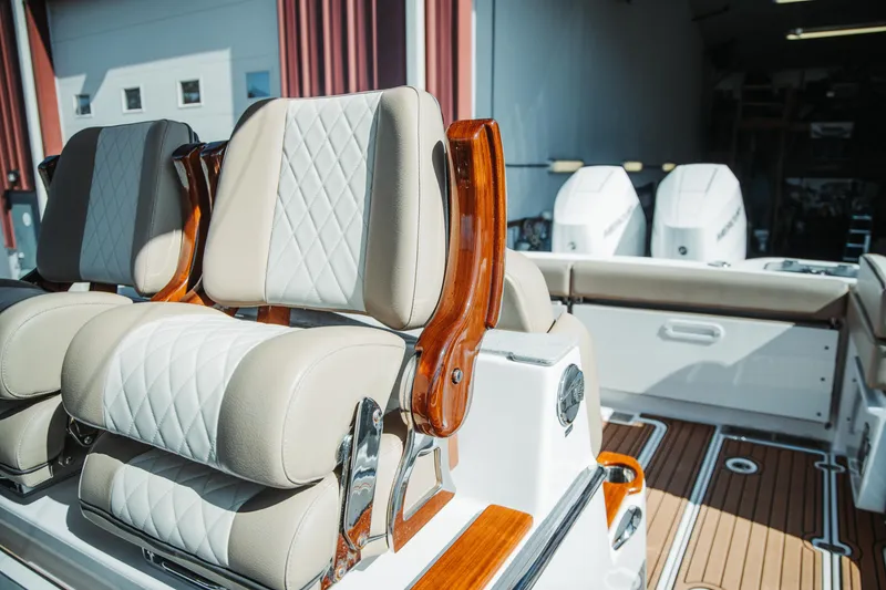 Slide: The Image of 2024 Everglades 315 Center Console boat with luxurious seating and dual engines. - 87