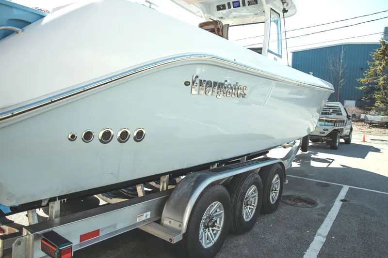 Slide: The Image of 2024 Everglades 315 Center Console on trailer outdoors. - 9