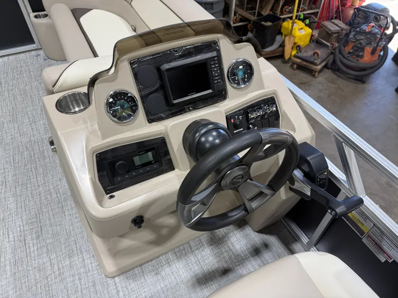 Slide: The Image of 2025 Tahoe Sport VRB 2385 boat console with modern electronics. - 11