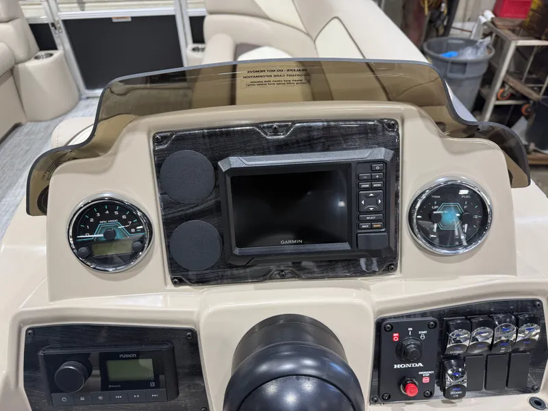 Slide: The Image of Dashboard of the 2025 Tahoe Sport VRB 2385 Swingback boat. - 13