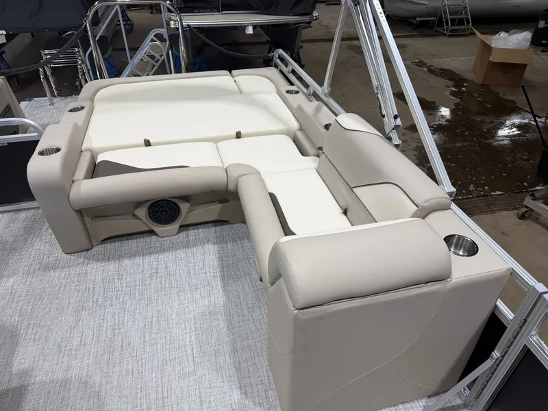 Slide: The Image of 2025 Tahoe Sport VRB 2385 Swingback interior with beige seating. - 18