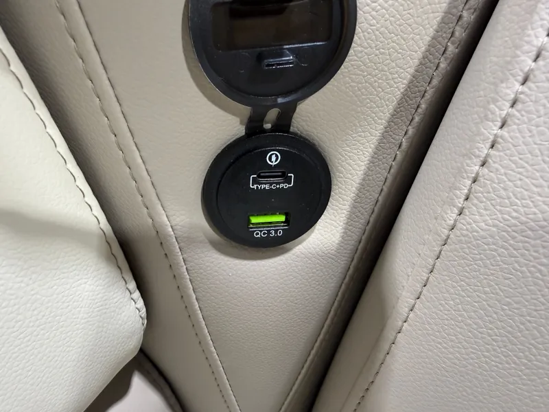 Slide: The Image of USB-C and QC 3.0 charging port in beige leather. - 32