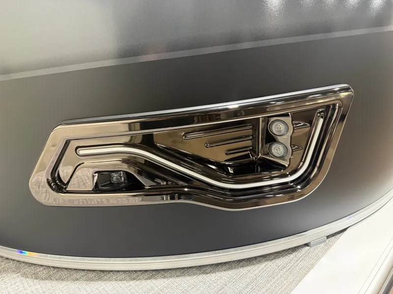 Slide: The Image of 2025 Tahoe Sport VRB 2385 boat detail with chrome accents. - 36