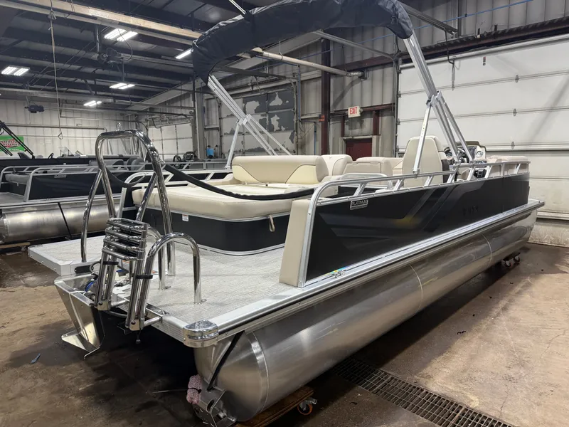 Slide: The Image of 2025 Tahoe Sport VRB 2385 pontoon boat in warehouse. - 44