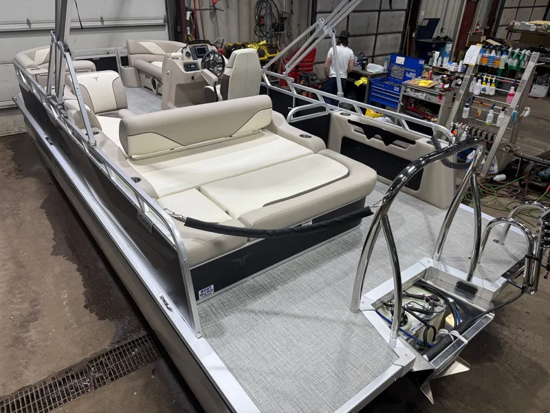 Slide: The Image of 2025 Tahoe Sport VRB 2385 Swingback pontoon boat in indoor setting. - 46