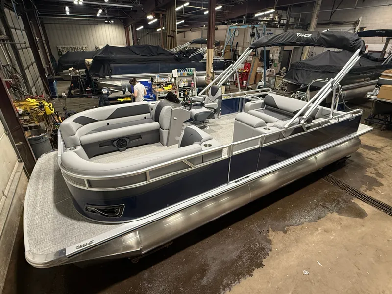 The Image of 2025 Tahoe Sport VRB 2385 pontoon boat in warehouse. - 1