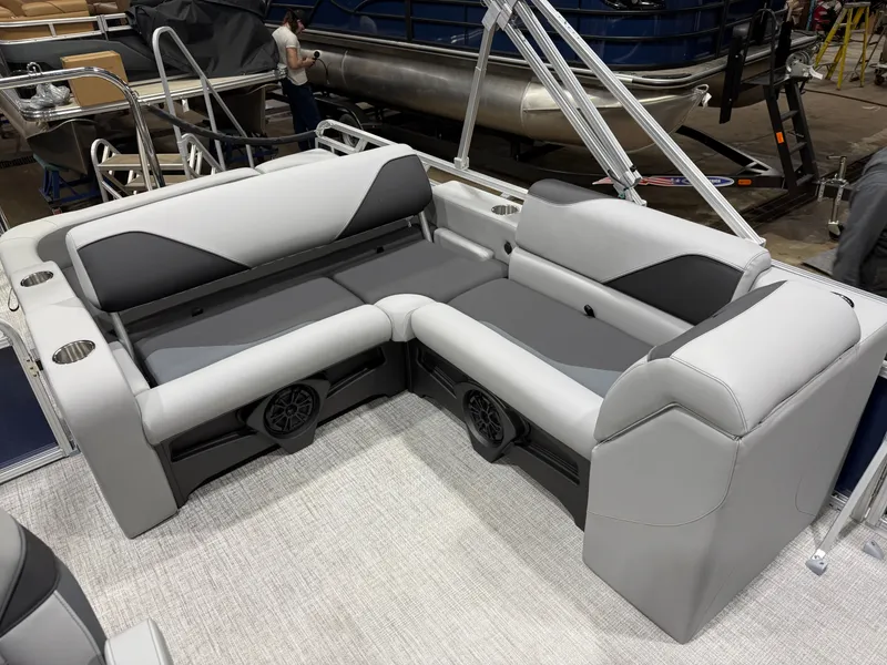 Slide: The Image of 2025 Tahoe Sport VRB 2385 interior with gray upholstery and speakers. - 17