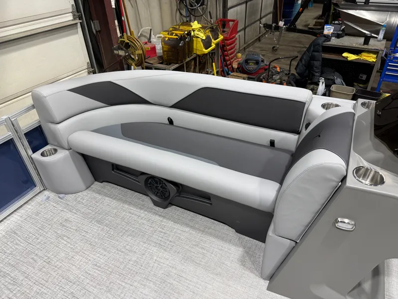 Slide: The Image of 2025 Tahoe Sport VRB 2385 boat interior with gray seating. - 32