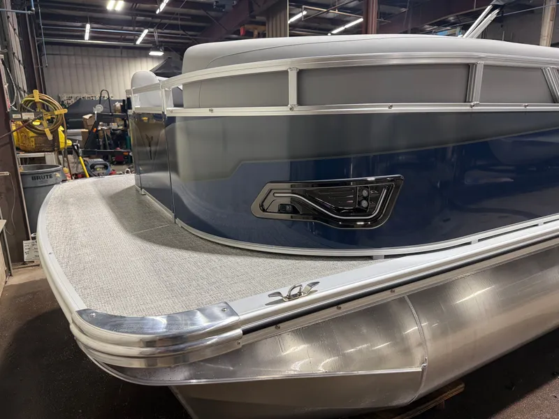 Slide: The Image of 2025 Tahoe Sport VRB 2385 pontoon boat in indoor setting. - 38