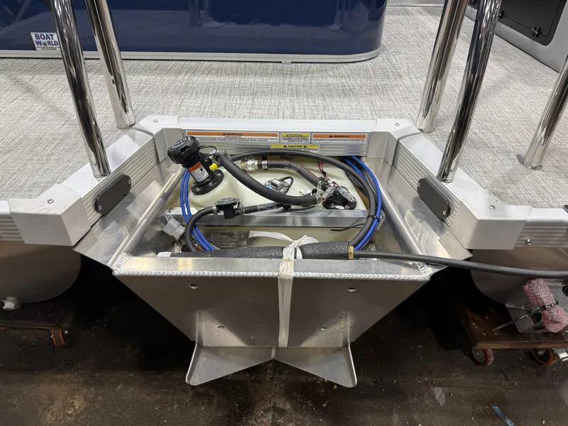 Slide: The Image of 2025 Tahoe Sport VRB 2385 boat engine compartment with hoses and cables. - 43