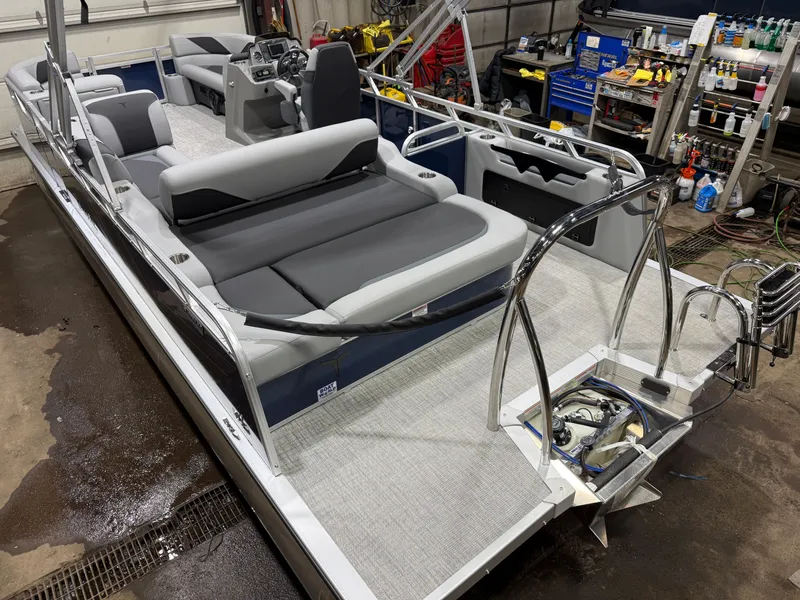 Slide: The Image of 2025 Tahoe Sport VRB 2385 Swingback pontoon boat in workshop area. - 48