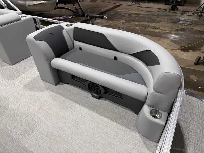 Slide: The Image of 2025 Tahoe Sport VRB 2385 boat interior with gray seating. - 9