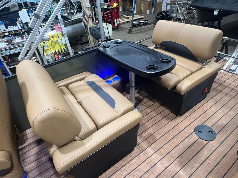Slide: The Image of Interior of Bentley Pontoons Legacy 220 QSB, luxurious seating and table. - 19