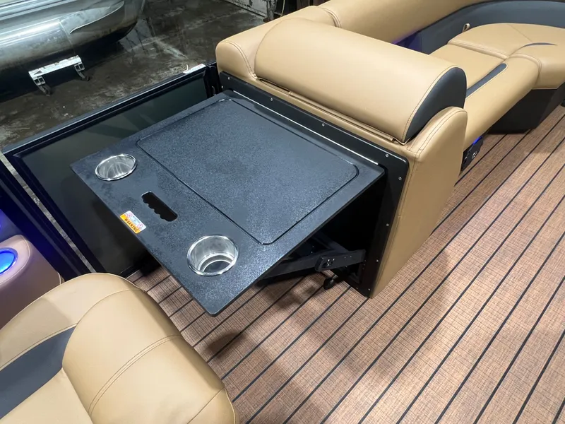 Slide: The Image of Interior of Bentley Pontoons Legacy 220 QSB with foldable table and cup holders. - 27