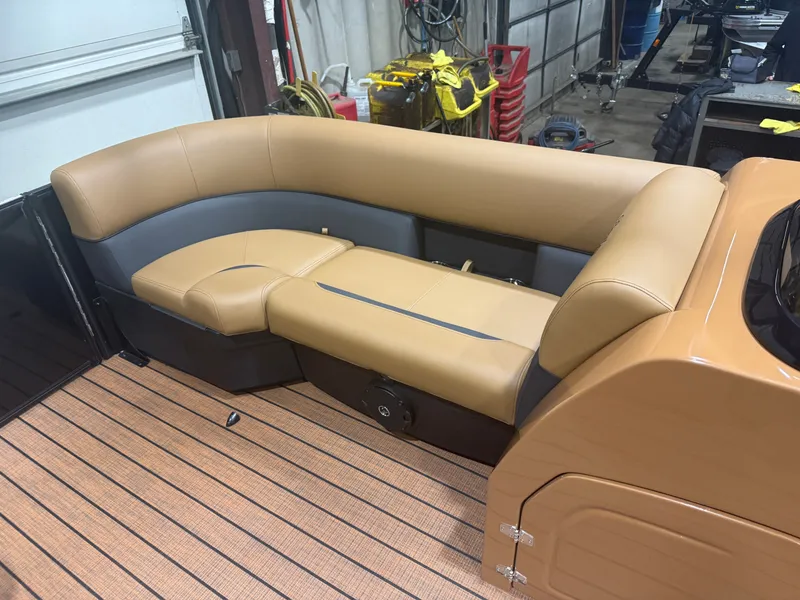 Slide: The Image of 2026 Bentley Pontoons Legacy 220 interior with beige lounge seating. - 25