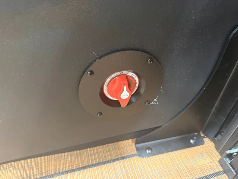 Slide: The Image of Close-up of a switch in the 2026 Bentley Pontoons Legacy 220 Navigator. - 29