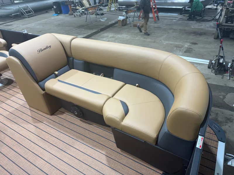 Slide: The Image of 2026 Bentley Pontoons Legacy 220 interior with beige quad lounge seating. - 9