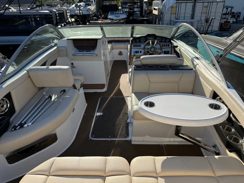 Slide: The Image of Interior of a 2015 Bryant Calandra boat with table and seating. - 4