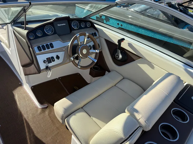 Slide: The Image of Interior of a 2015 Bryant Calandra boat with steering console. - 5