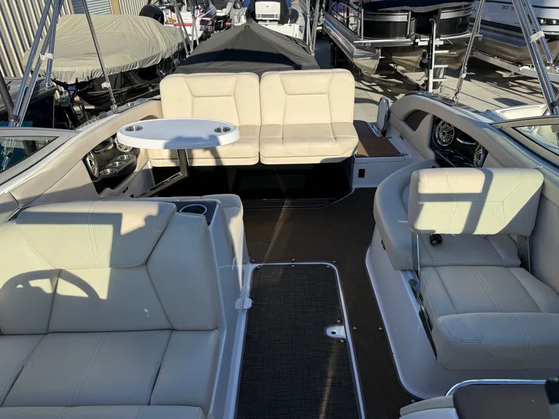 Slide: The Image of Interior of a 2015 Bryant Calandra boat with beige seating. - 6