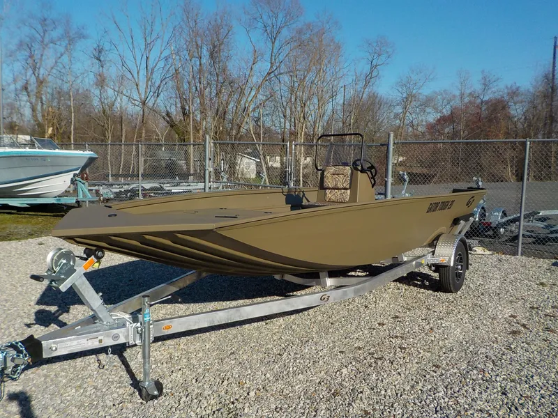 The Image of 2026 G3 Gator Tough Jon boat on trailer, parked outdoors. - 1