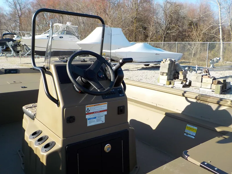 Slide: The Image of 2026 G3 Gator Tough Jon boat parked outdoors. - 3