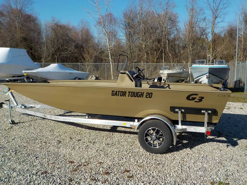 Slide: The Image of 2026 G3 Gator Tough 20 CC boat on trailer outdoors. - 6