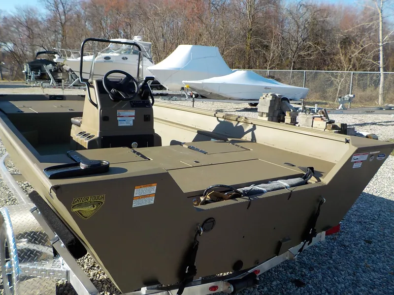 Slide: The Image of 2026 G3 Gator Tough Jon boat on trailer outdoors. - 7