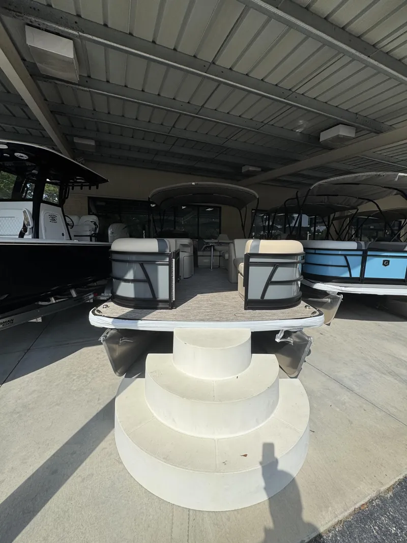 Slide: The Image of 2026 Godfrey SW 2286 Fish Stern pontoon boat under cover. - 27