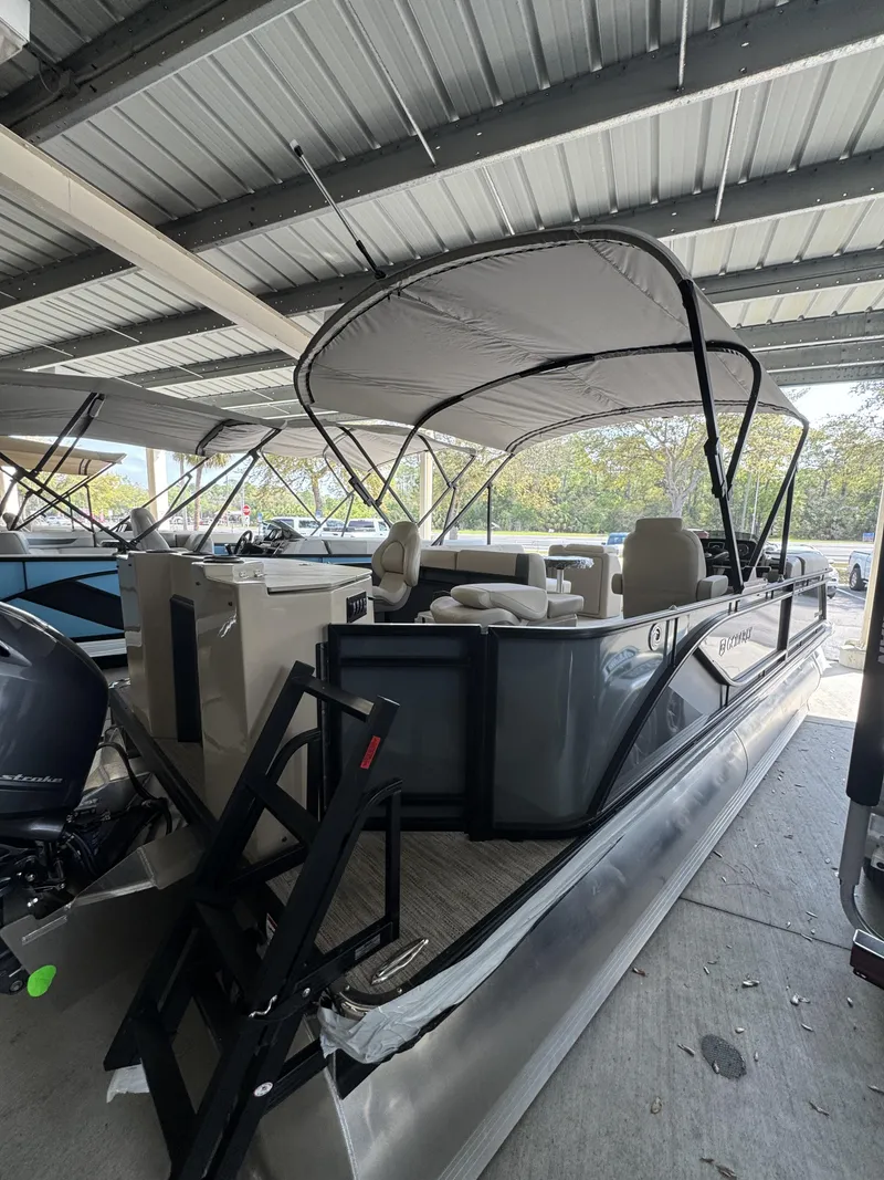 Slide: The Image of 2026 Godfrey SW 2286 Fish Stern pontoon boat under cover. - 3