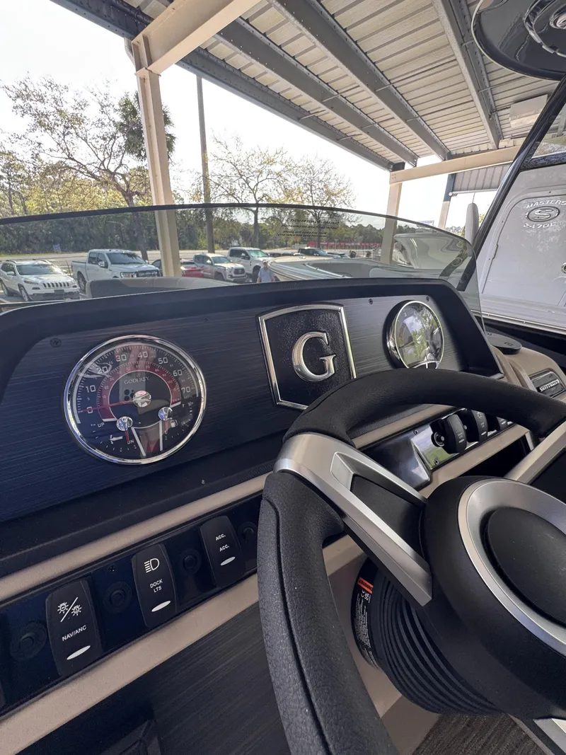 Slide: The Image of Dashboard of 2026 Godfrey SW 2286 Fish Stern with steering wheel and gauges. - 44