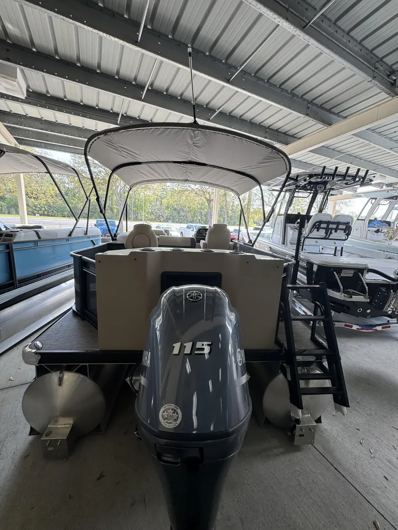 Slide: The Image of 2026 Godfrey SW 2286 Fish Stern pontoon boat in storage. - 5