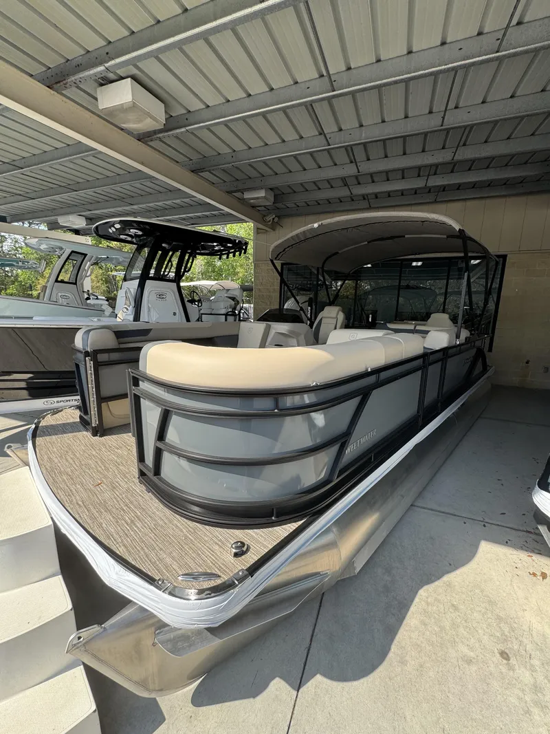 Slide: The Image of 2026 Godfrey SW 2286 Fish Stern pontoon boat under cover. - 6