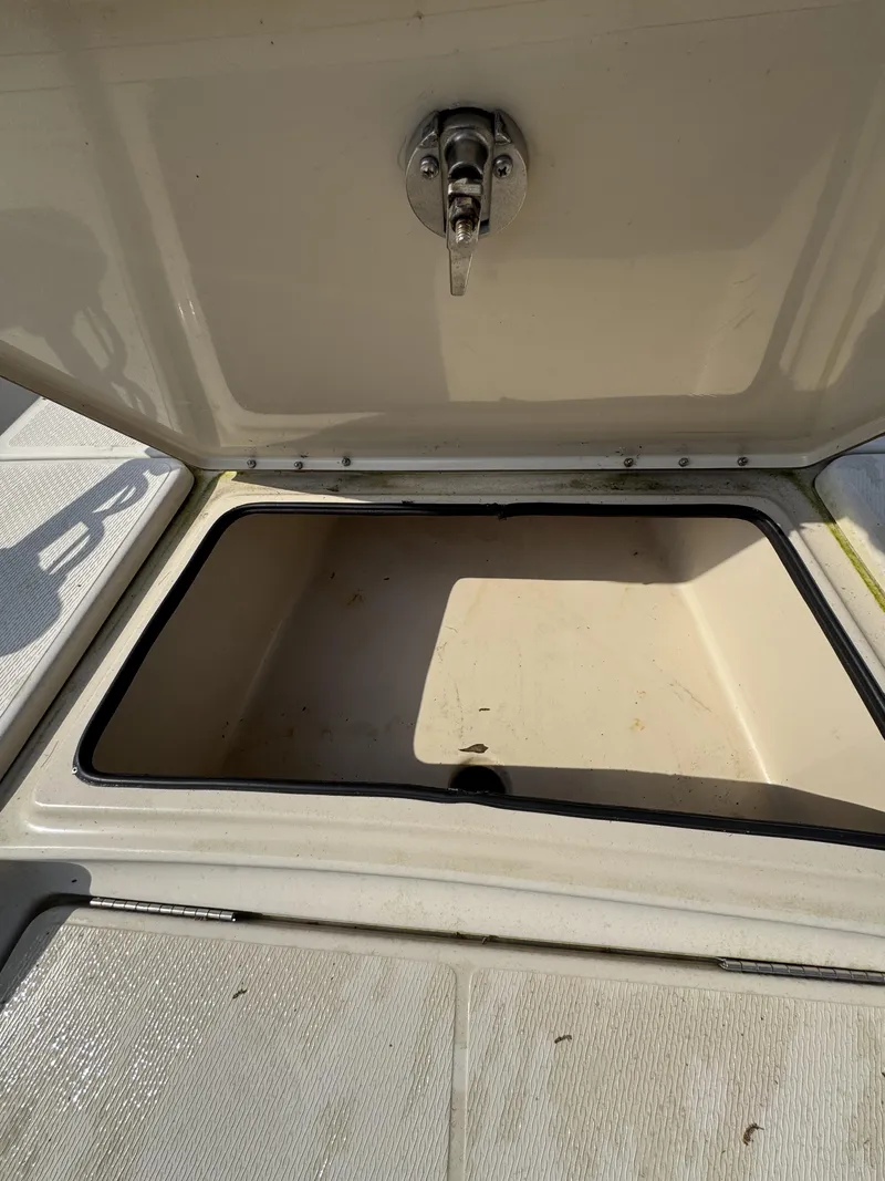 Slide: The Image of Open storage compartment on a 2020 Blue Wave 2200 PureBay boat. - 11
