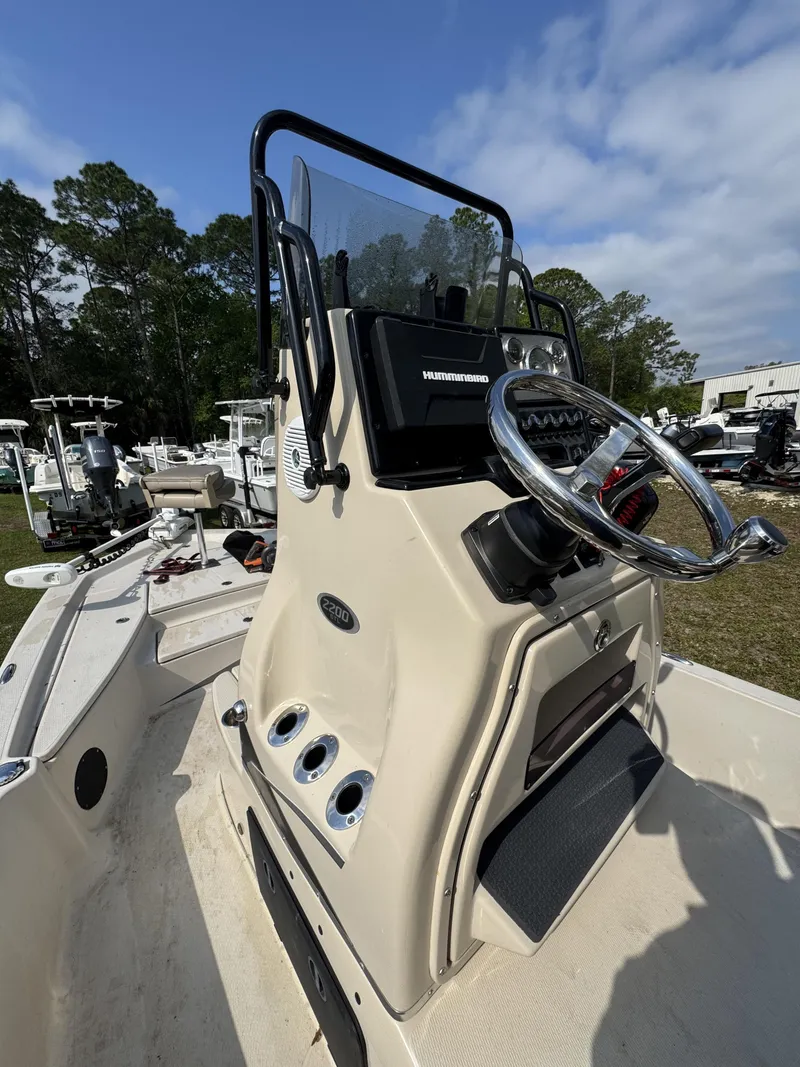 Slide: The Image of 2020 Blue Wave 2200 PureBay boat console with steering wheel and instruments. - 18