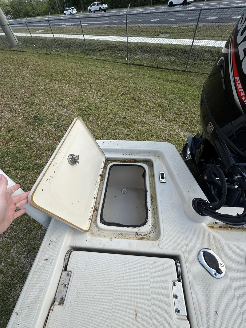 Slide: The Image of 2020 Blue Wave 2200 PureBay boat with open storage compartment. - 25