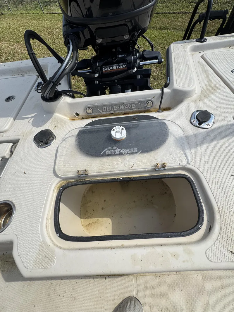 Slide: The Image of Blue Wave 2200 PureBay 2020 boat with open storage compartment. - 28