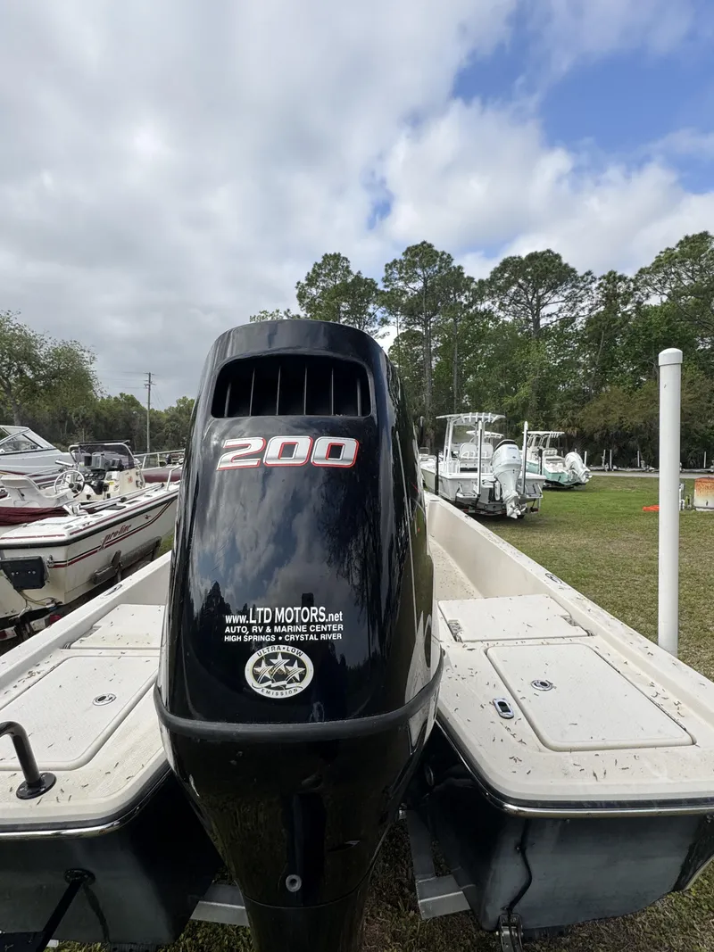 Slide: The Image of Outboard motor of a 2020 Blue Wave 2200 PureBay boat. - 4