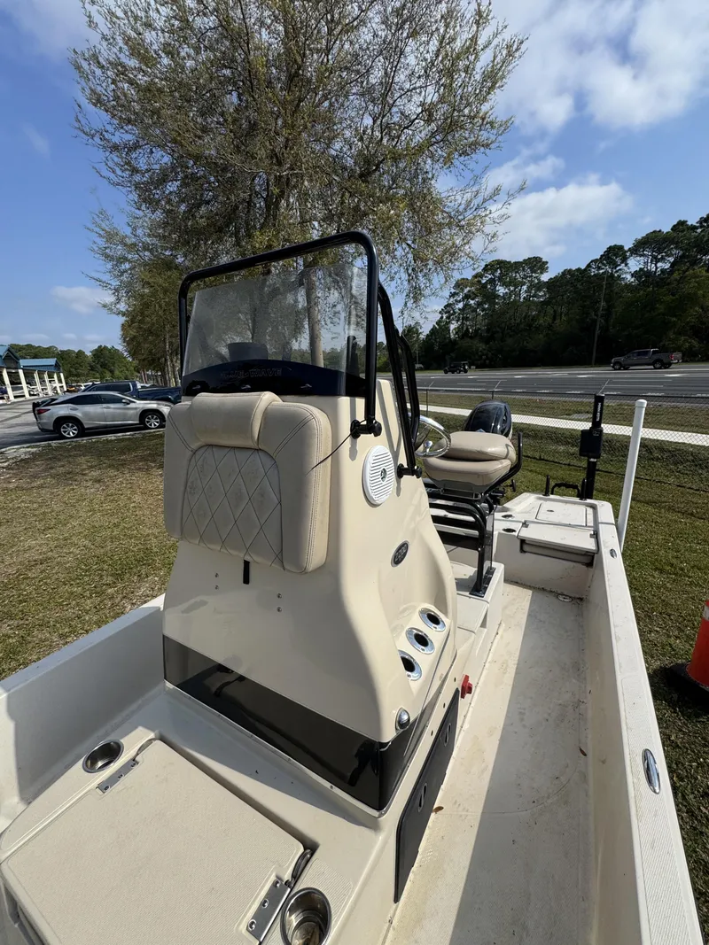 Slide: The Image of 2020 Blue Wave 2200 PureBay boat in a parking area. - 46