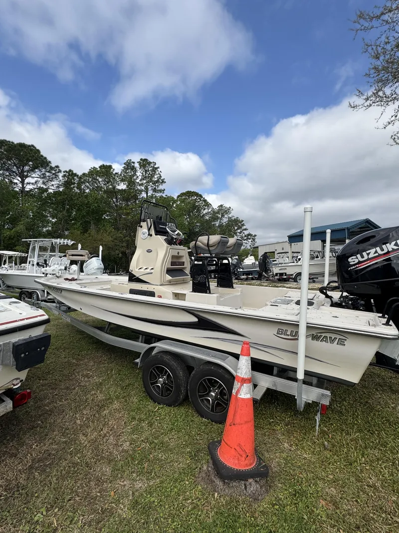 Slide: The Image of 2020 Blue Wave 2200 PureBay boat on trailer outdoors. - 7