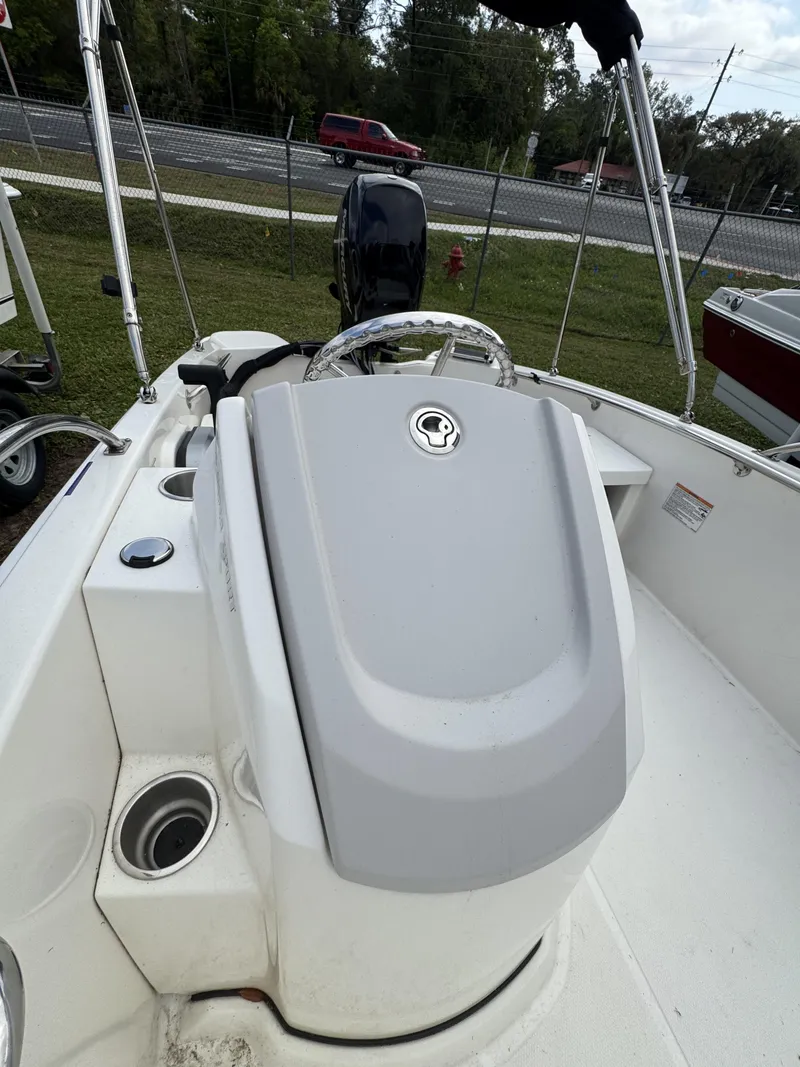 Slide: The Image of 2024 Boston Whaler 130 Super Sport boat cockpit view. - 10