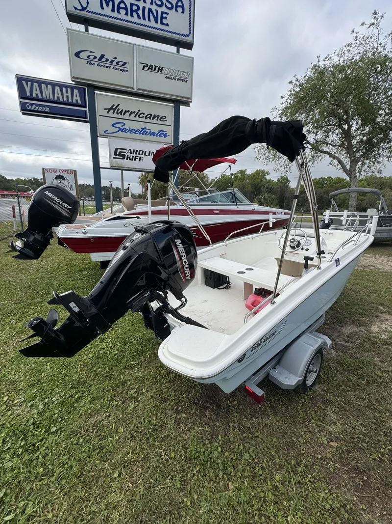 Slide: The Image of 2024 Boston Whaler 130 Super Sport boat on trailer. - 12