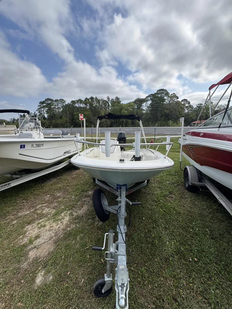 Slide: The Image of 2024 Boston Whaler 130 Super Sport on trailer, parked outdoors. - 6