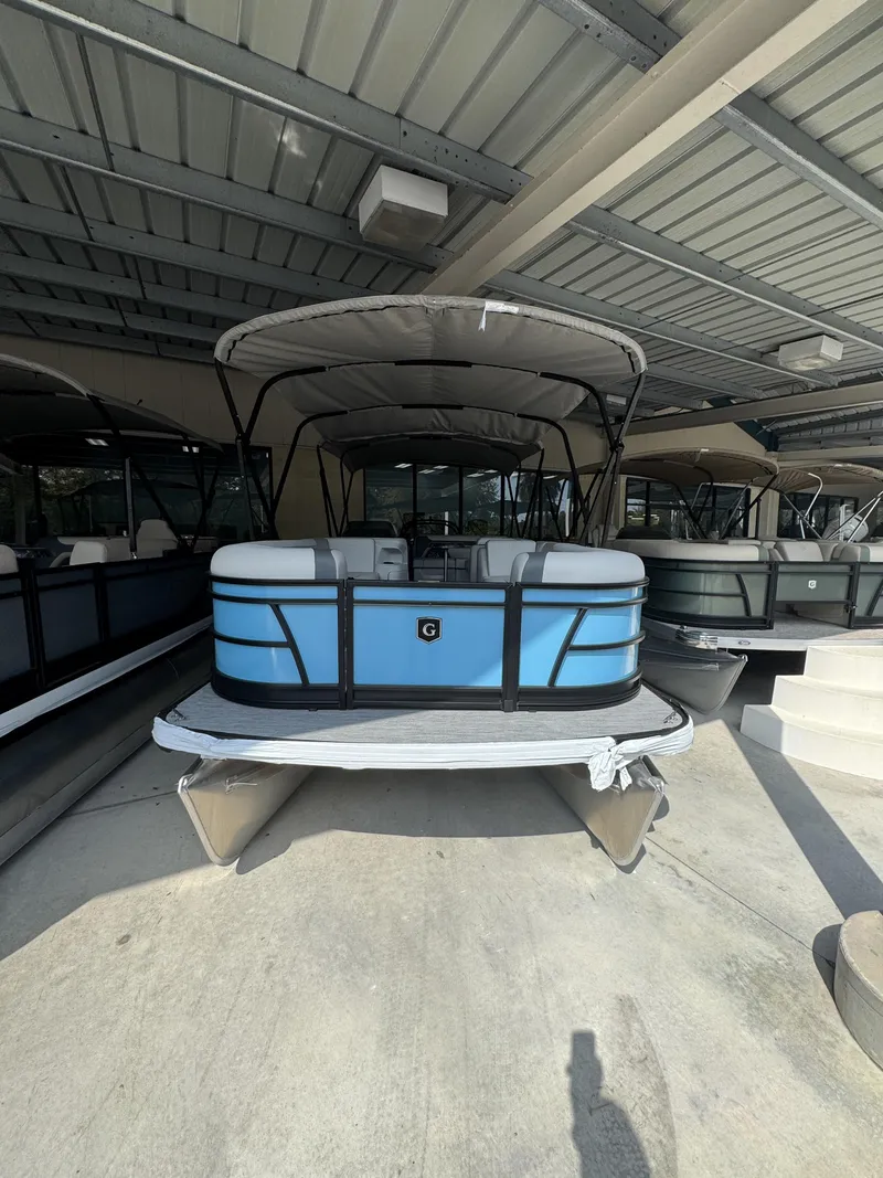 Slide: The Image of 2026 Godfrey SW 2286 Cruise Special Edition pontoon boat in storage. - 2