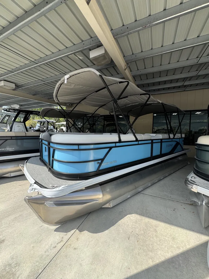 Slide: The Image of 2026 Godfrey SW 2286 Cruise Special Edition pontoon boat under canopy. - 26