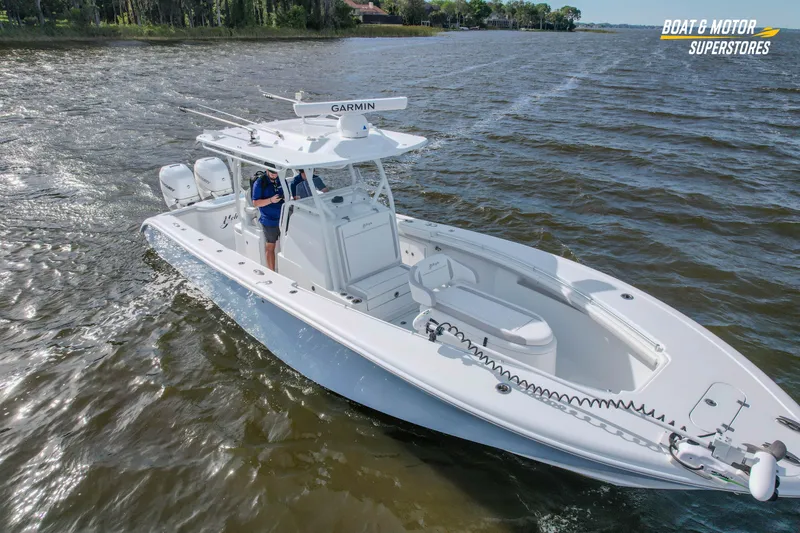Slide: The Image of 2020 Yellowfin 32 Offshore boat cruising on a lake with Garmin equipment. - 10