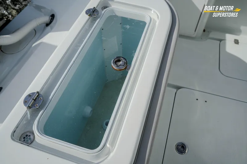 Slide: The Image of Livewell on 2020 Yellowfin 32 Offshore boat deck, featuring clear lid and hinges. - 15