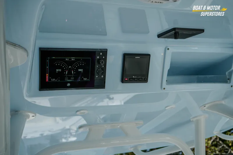 Slide: The Image of Dashboard of a 2020 Yellowfin 32 Offshore boat with electronic displays. - 20