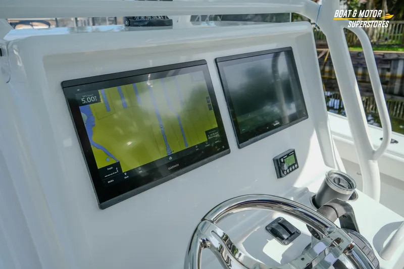 Slide: The Image of Dashboard of a 2020 Yellowfin 32 Offshore boat with dual Garmin displays. - 21