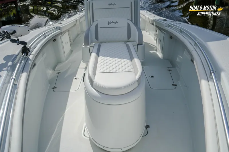 Slide: The Image of 2020 Yellowfin 32 Offshore boat interior with cushioned seating and sleek design. - 30